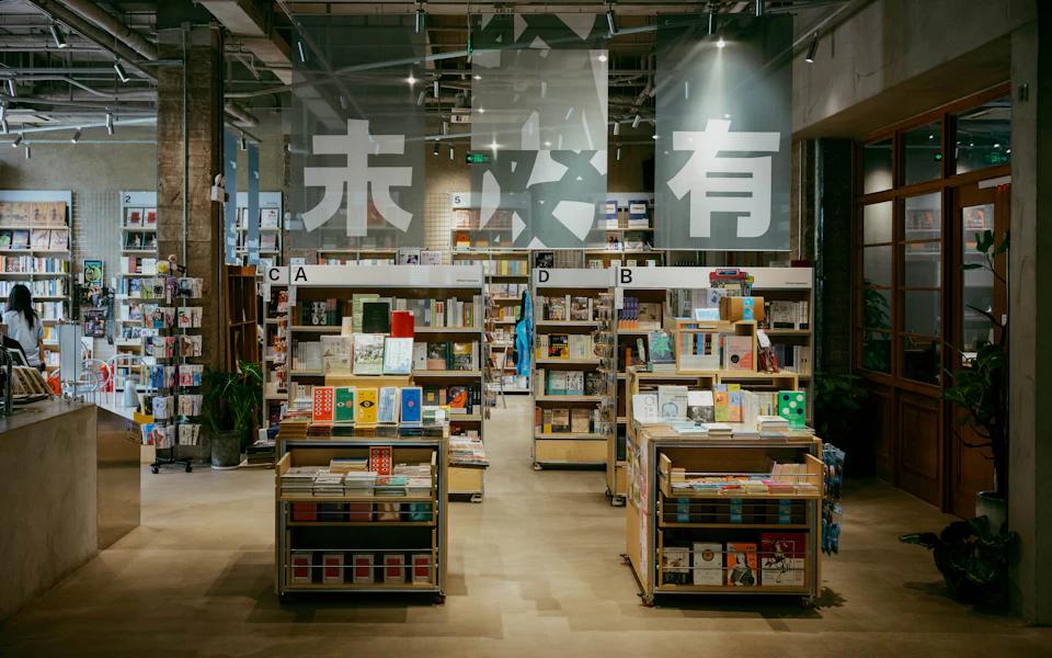 Bookshelves and display tables inside a modern bookshop