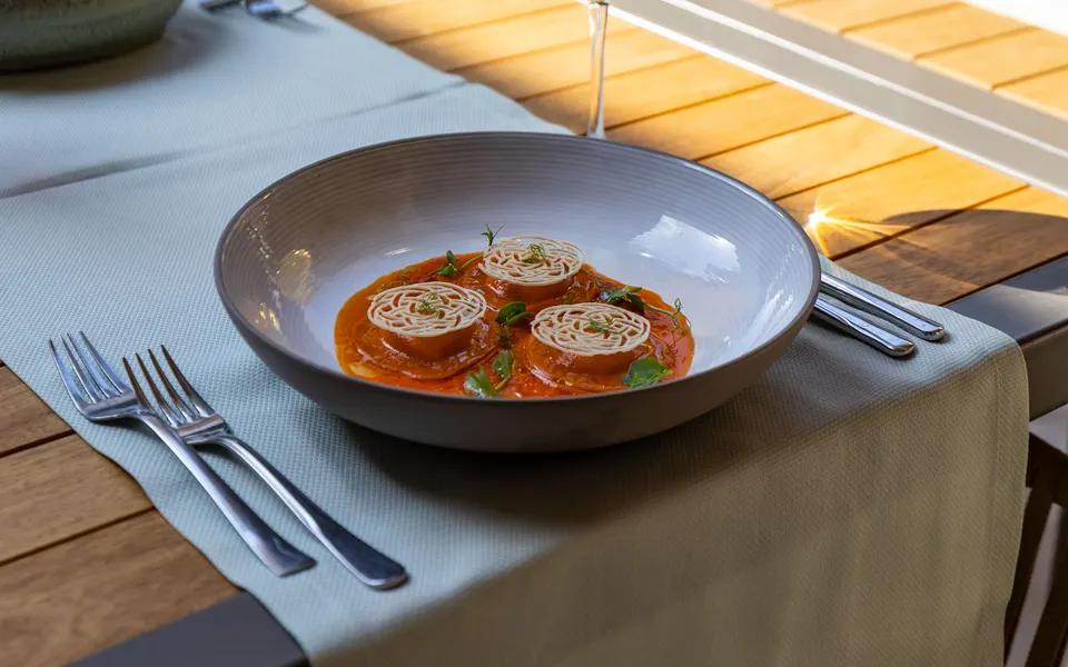 A plated meal at a prepared restaurant dining table