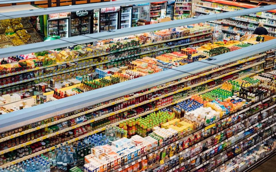 Supermarket aisles stocked with fresh food and groceries